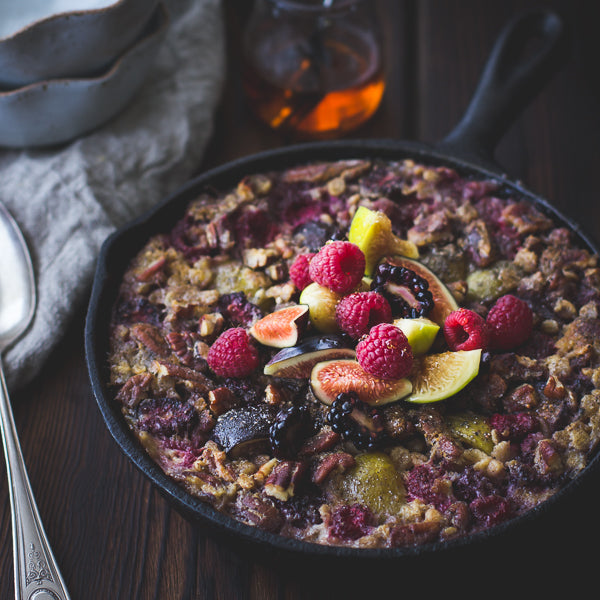 Nourishing skillet baked rolled barley with figs, berries, and cardamom